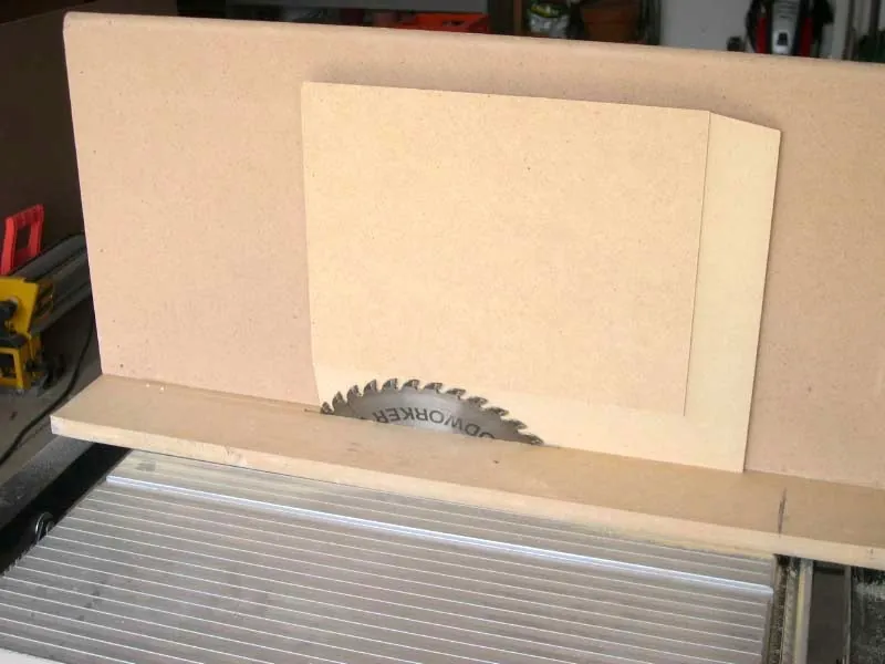 Adjusting the carbide-tipped blade height before cutting medium-density fiberboard on a saw.