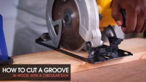 A circular saw rests on a wooden board featuring a clean, precise groove.