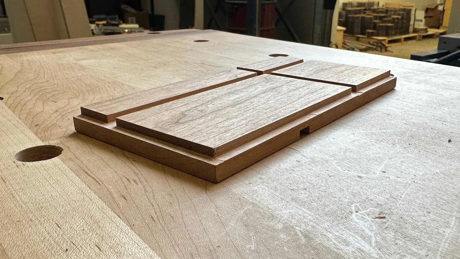 A detailed close-up shows the clean, sharp edges of a wood groove.