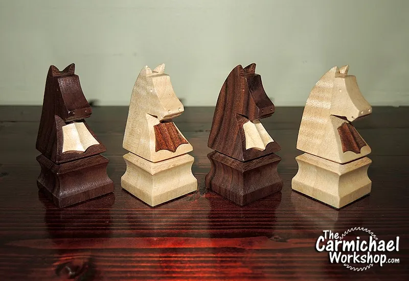 Drawing a chess piece silhouette onto a square block of hardwood.