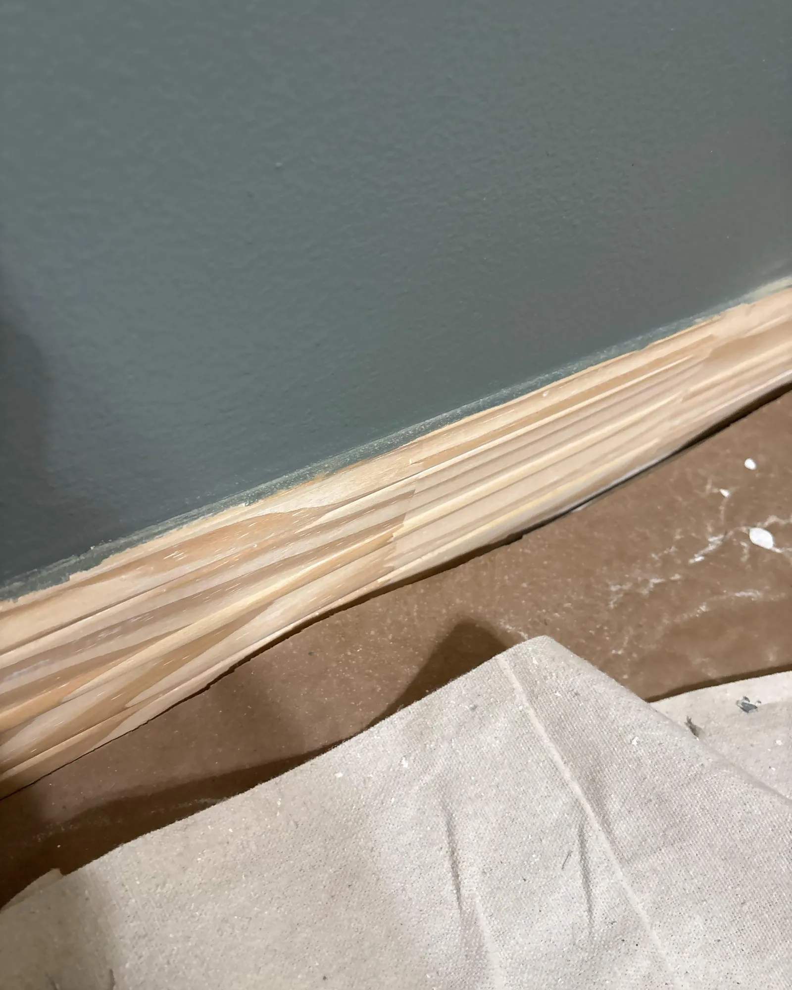 Peeling paint layers on a wall indicating the need for professional lead inspection.