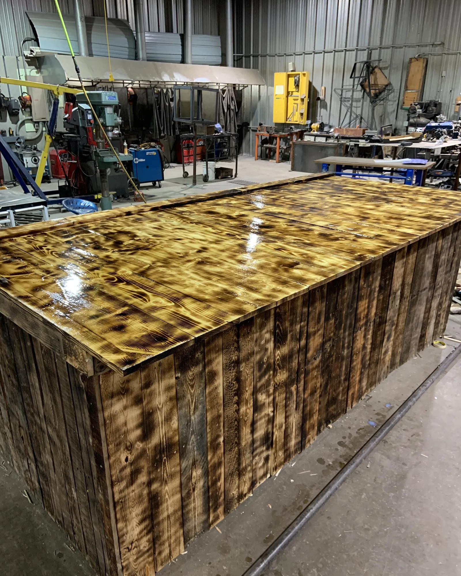A streak in a drying polyurethane finish on a wooden surface.
