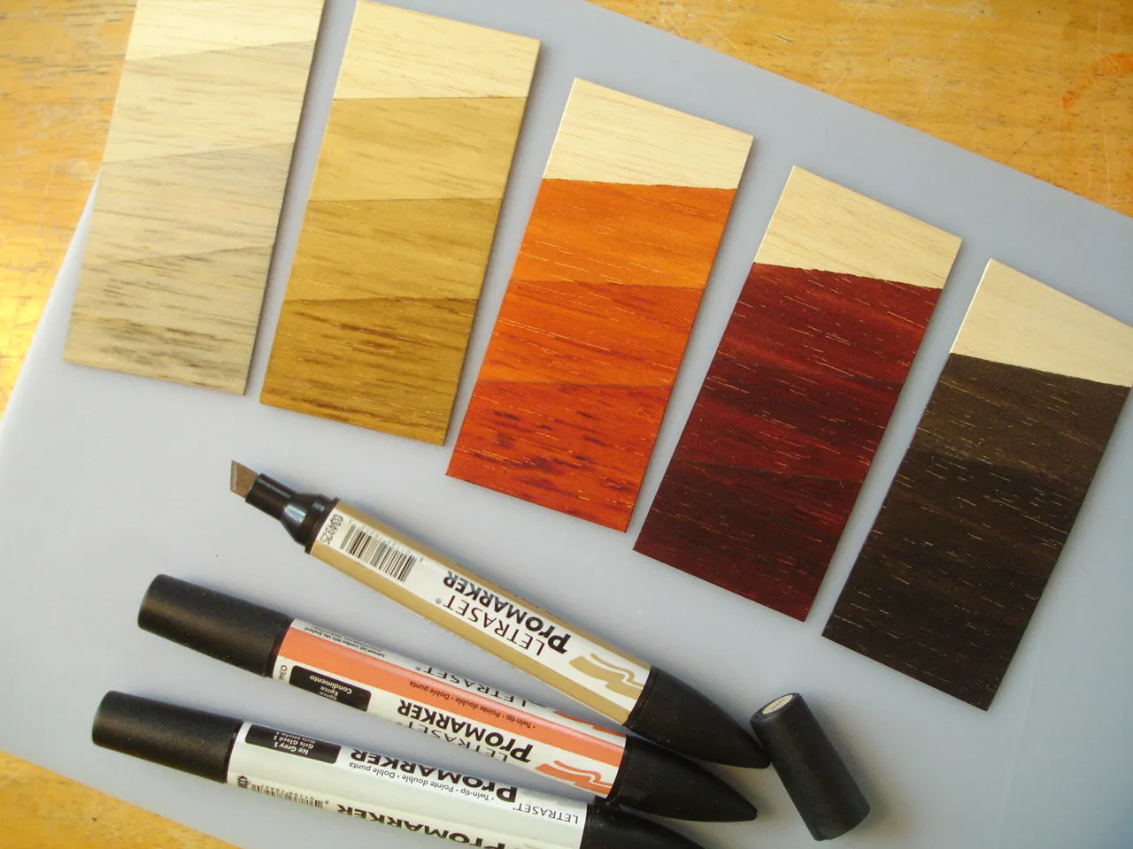Tools for fixing uneven wood stain on a balsa wood project.