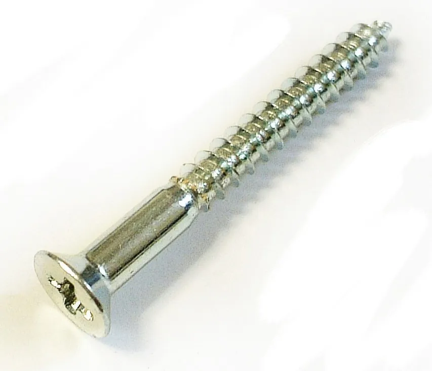 Various wood samples with screws driven into different sized pilot holes.