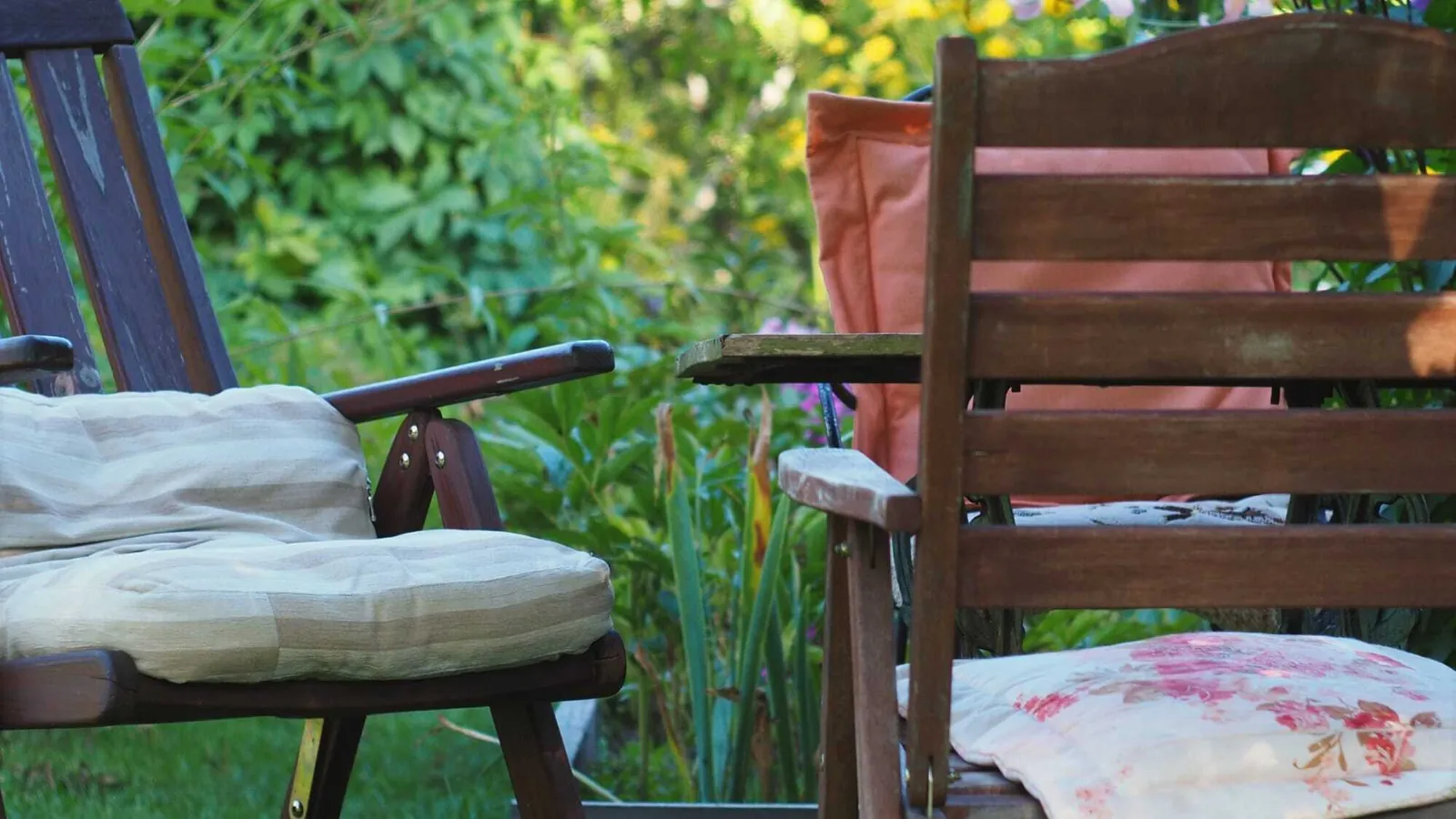 Weathered wood furniture leg showing signs of wear from outdoor exposure.