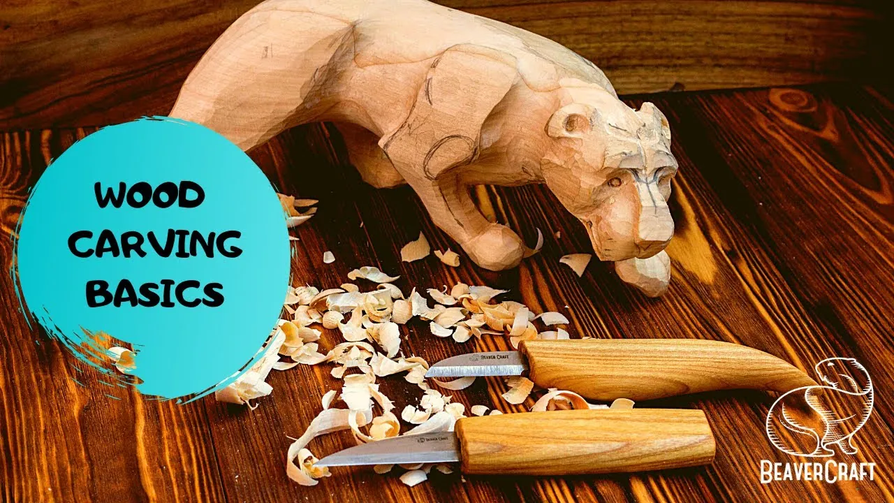 A wood carving project showing torn grain next to a sharpening stone on a desk.