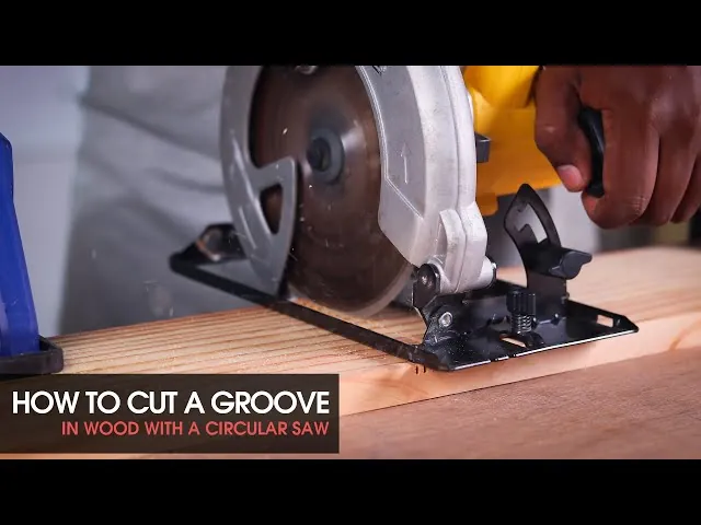 A woodworker prepares to cut a groove in wood using a circular saw.